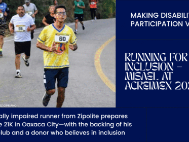 Visually impaired runner Misael Pérez Robles wearing a yellow Jule Perro jersey during a road race, surrounded by other runners on a curved street in Oaxaca.