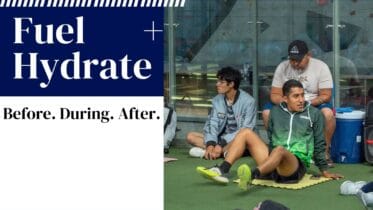 Athletes resting near water cooler during training in Oaxaca, Mexico