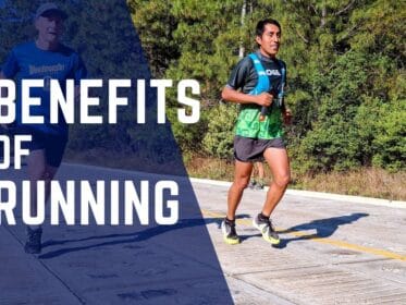 Two runners on a road with text overlay: Benefits of Running.