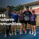 Group of Oax Sport athletes at a track in Oaxaca with the text Sports Transform Communities.