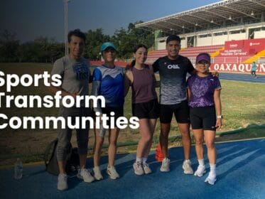 Group of Oax Sport athletes at a track in Oaxaca with the text Sports Transform Communities.