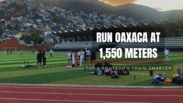 Cover image for the article Run Oaxaca at 1,550 meters, showing runners warming up on a track with a hillside neighborhood in the background and the subtitle Top 5 routes to train smarter.