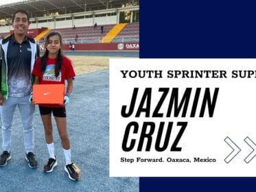 Coach and youth sprinter stand on a track in Oaxaca, Mexico. The athlete holds an orange Nike shoe box. A title card reads “Youth Sprinter Support. Jazmin Cruz. Step Forward. Oaxaca, Mexico.”
