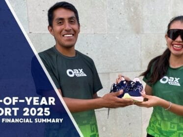 Two Oax Sport members in green shirts smiling while holding a pair of running shoes, with the text “End-of-Year Report 2025” and “Impact + Financial Summary” on the left.