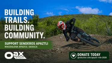 Mountain biker riding a hand-built dirt trail at Senderos Apaztli in Magdalena Apazco, Oaxaca, with Oax Sport branding and a donation callout.