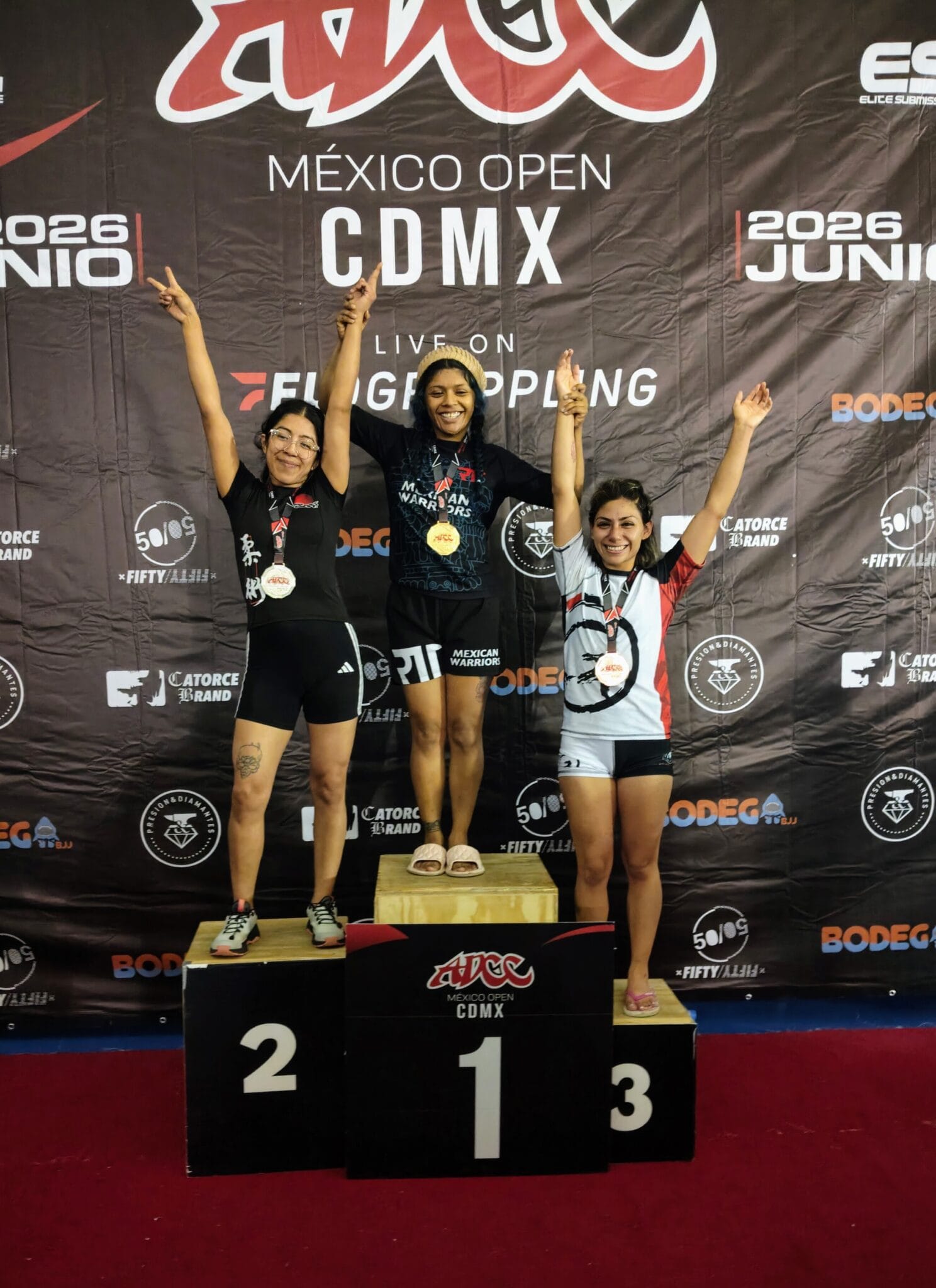 Emily Barrera celebrating with the other medalists on the podium at ADCC Open Mexico City in Mexico City.