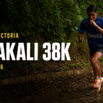 Juan Zurita Victoria running on a wet forest trail in a blue Titanes jersey. The social card includes the text “Juan Zurita Victoria,” “Komakali 38K,” and “October 3, 2026.”