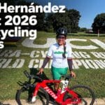 Gilda Hernández stands beside her red racing bicycle at the 2026 UCI Para-cycling Road World Championships in Huntsville, with text announcing her 5th-place finish.